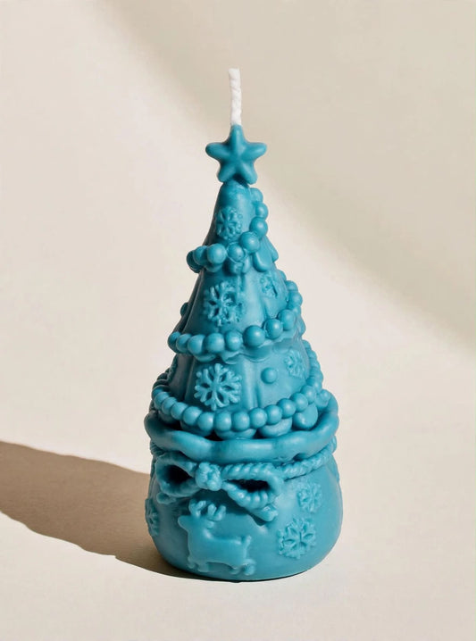 Vela turquesa con forma de árbol de Navidad y estrella